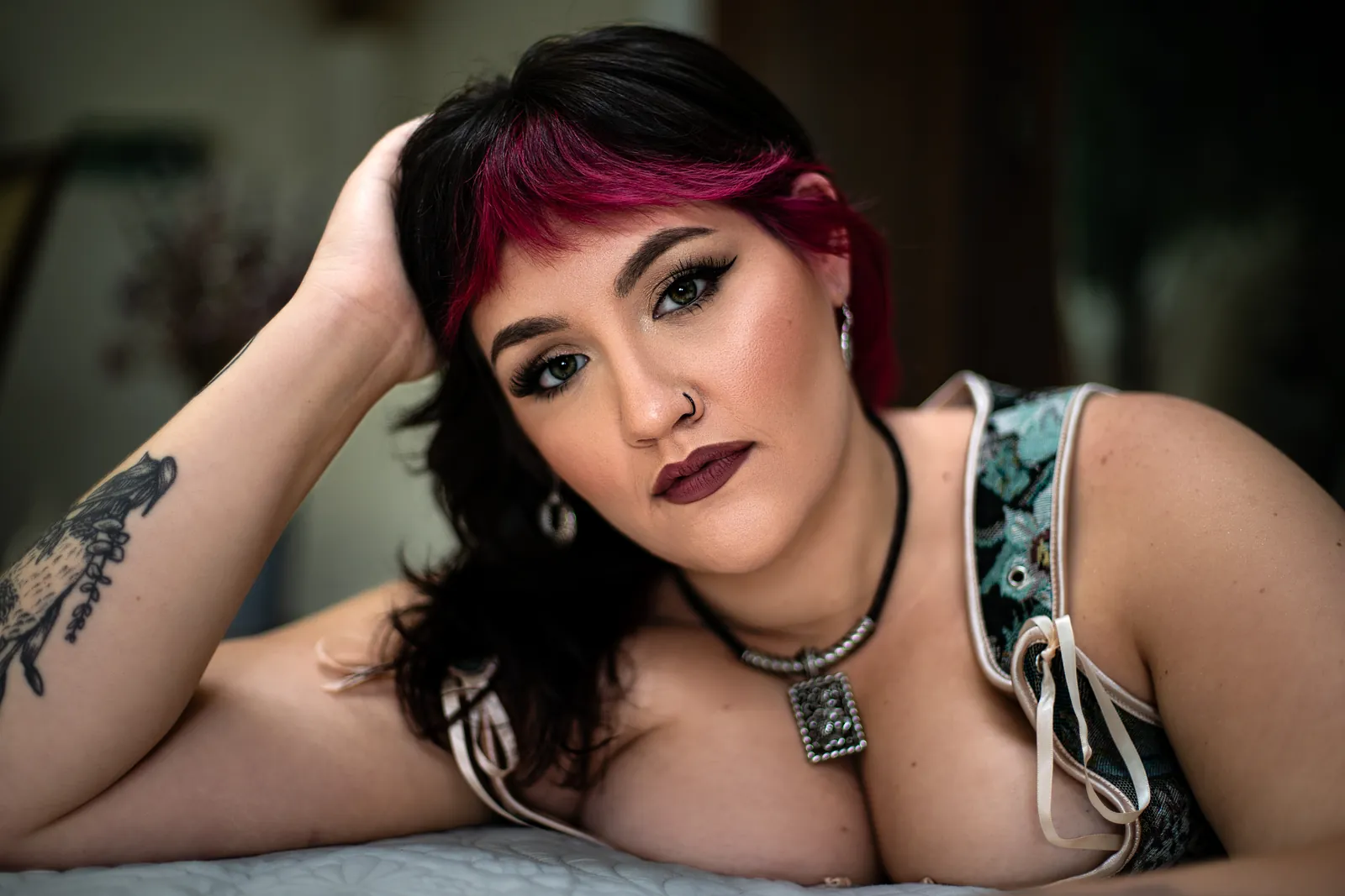close portrait of a woman resting her head on her hand with a confident gaze during an empowerment portrait session